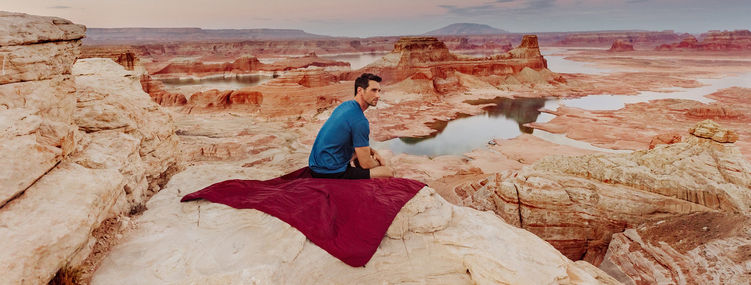 man sitting on blanket