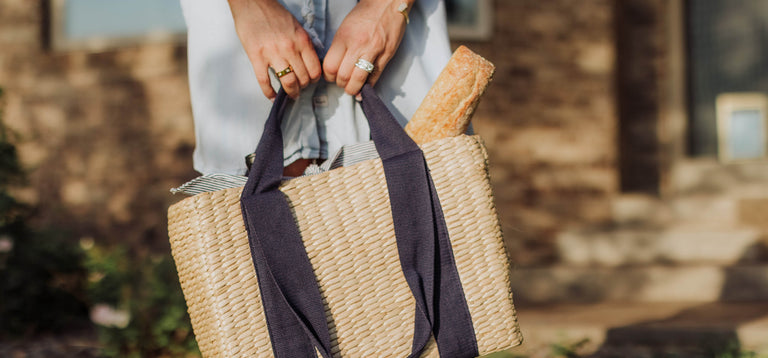 woman carrying picnic tote