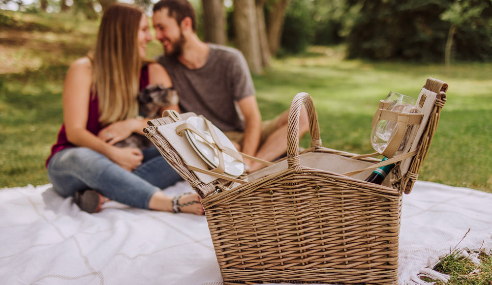 couple and dog with picnic basket