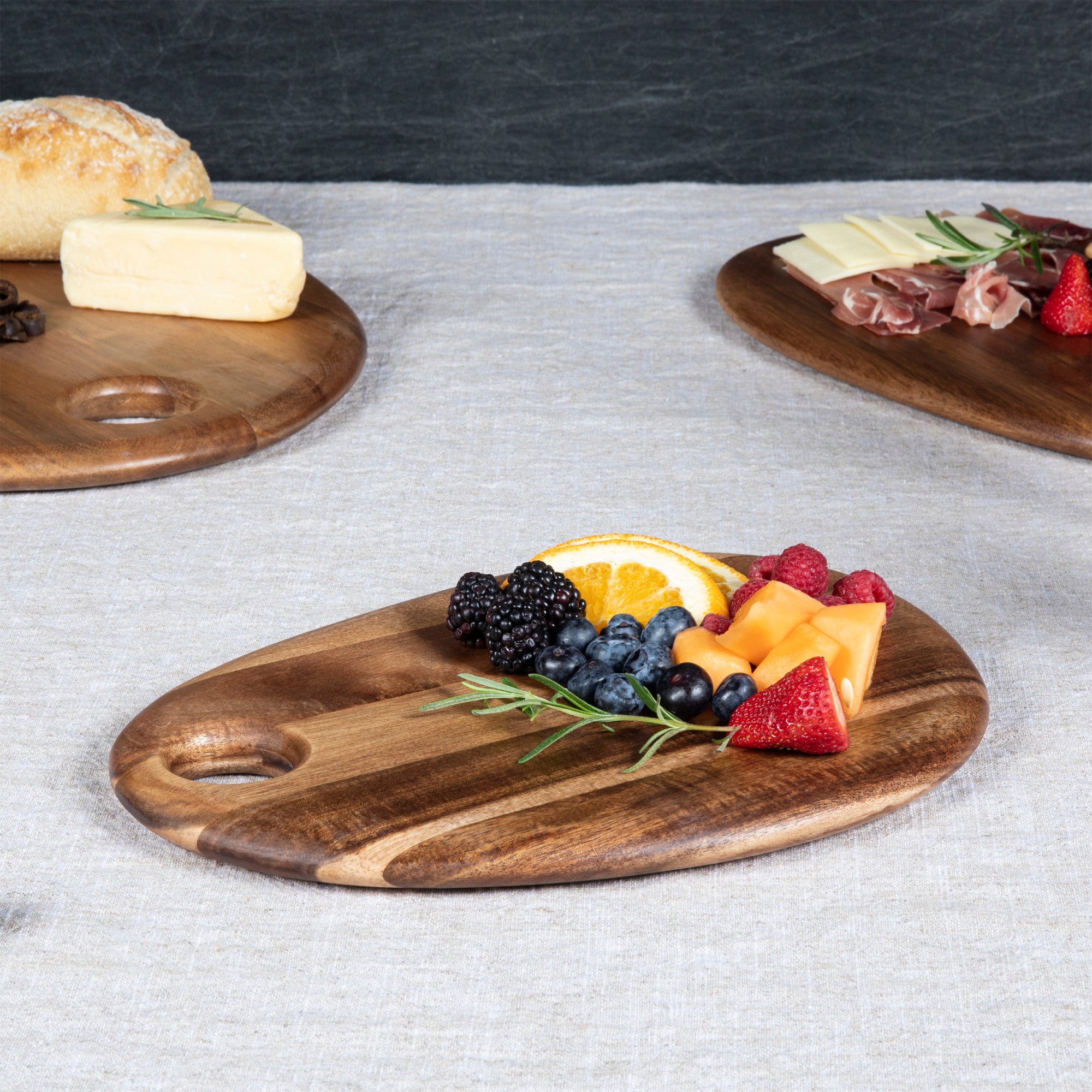 Tondo Natural Wood Paddle Serving Board with Handle Reviews | Crate & Barrel Tondo Natural Wood Paddle Serving Board with Handle Reviews | Crate & Barrel